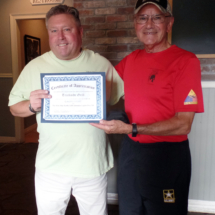 A Certificate of Appreciation is presented to Trackside Grill